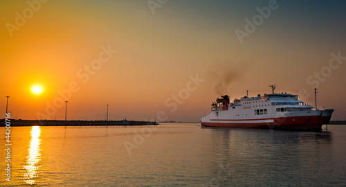view of passenger ferry boat in open waters in Greece at sunrise © iancucristi