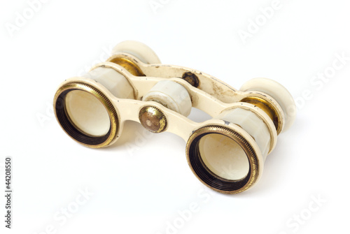 Old binoculars on white background