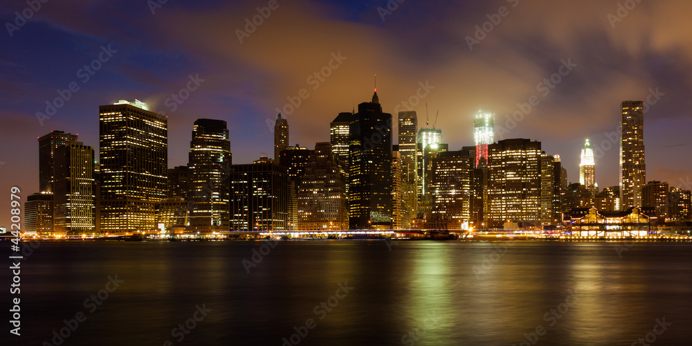 Manhattan skyline by night from Brooklyn bridge park