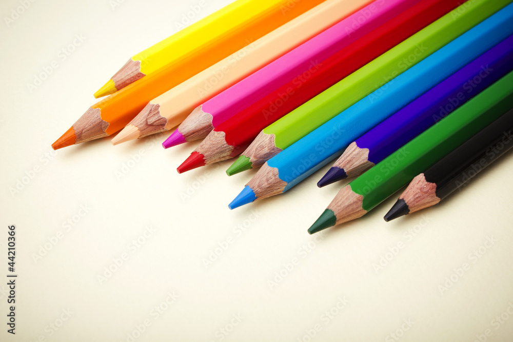 Color pencils crayons on paper background Color pencils crayons on paper background
