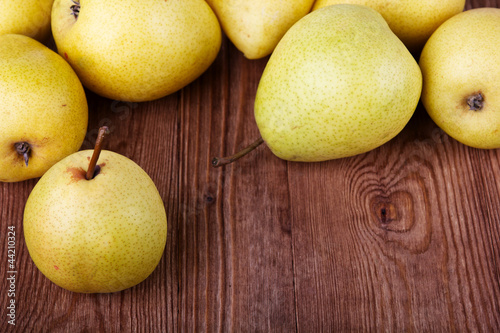 pears on old wooden background