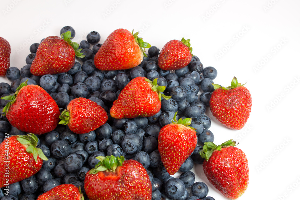 Blueberries and strawberries on white Blueberries and strawberries on white