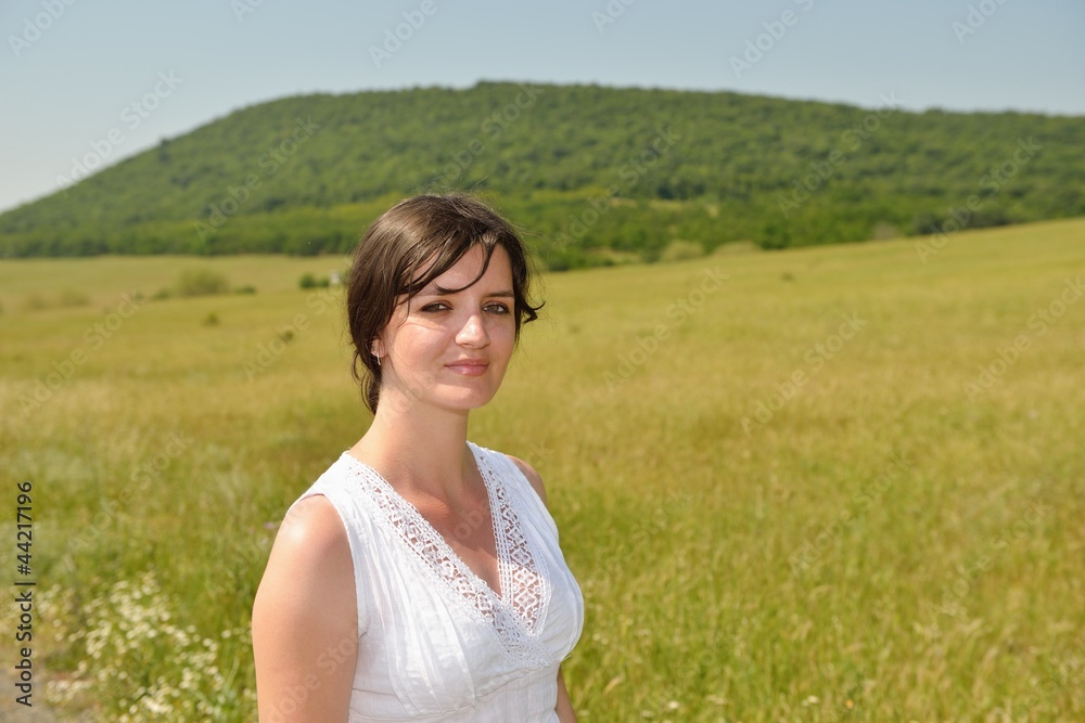 Young happy woman in green field Young happy woman in green field
