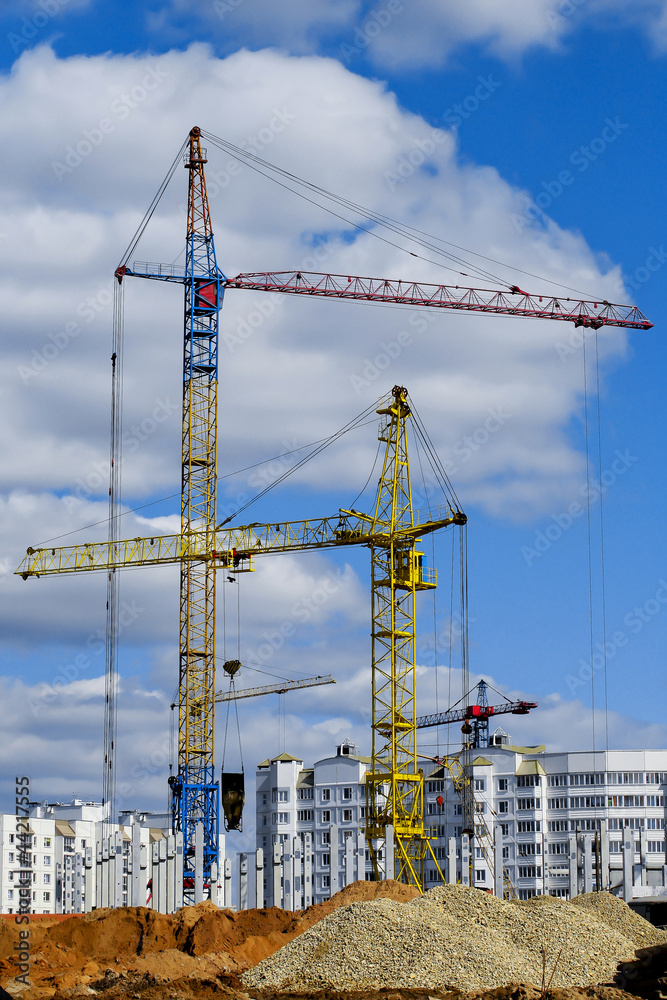 four cranes making building site construction four cranes making building site construction