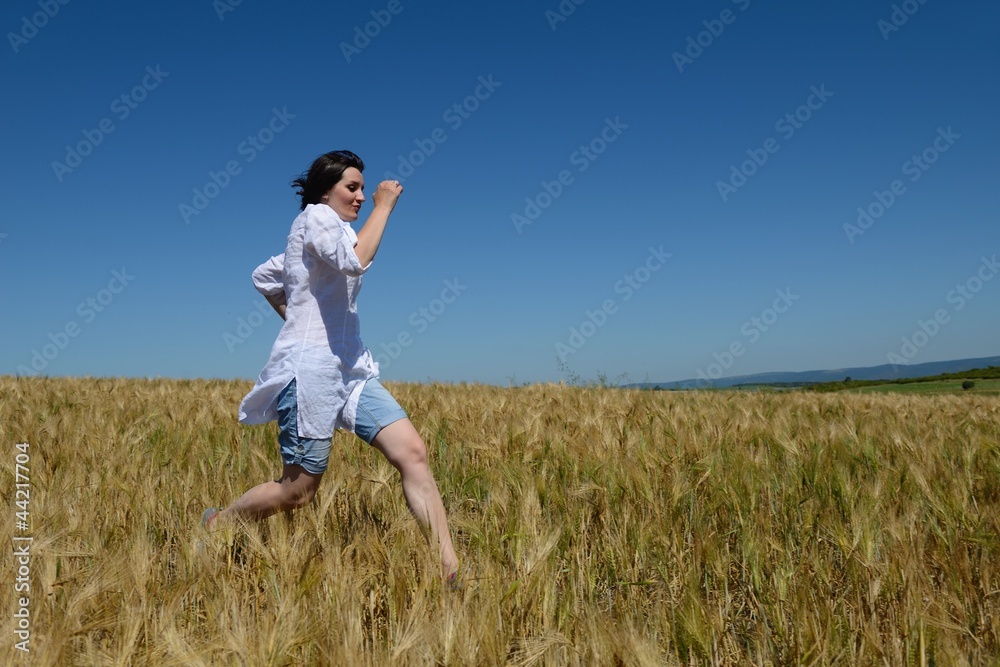 young woman in wheat field at summer young woman in wheat field at summer