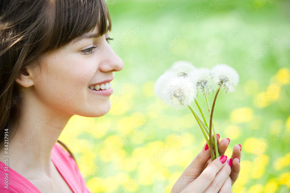 Young woman with dandelions Young woman with dandelions