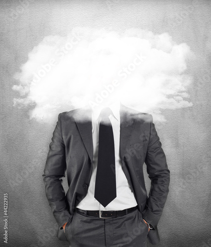 Businessman - head in the clouds photo