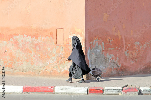 Muslim woman walking down the street
