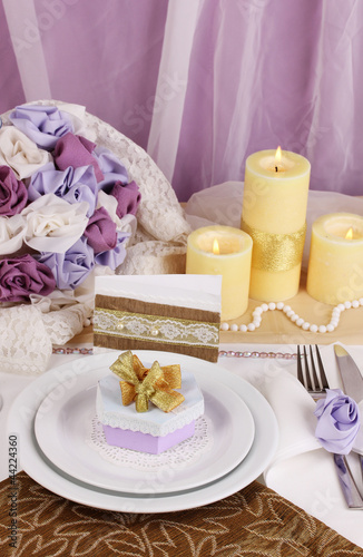 Serving fabulous wedding table in purple and gold color