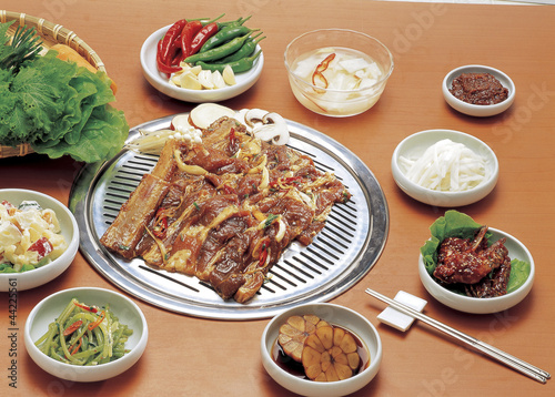 seasoned rib with vegetables on the barbecue grill 