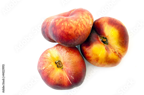flat peaches on white background