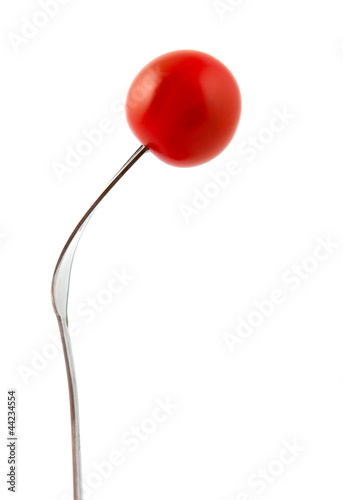 Juicy cherry tomato on a fork