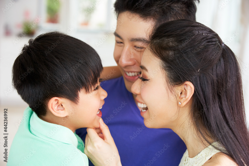 Head And Shoulders Portrait Of Chinese Family Together At Home Head And Shoulders Portrait Of Chinese Family Together At Home
