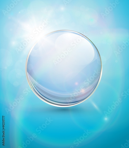Sunny blue background, with transparent sphere