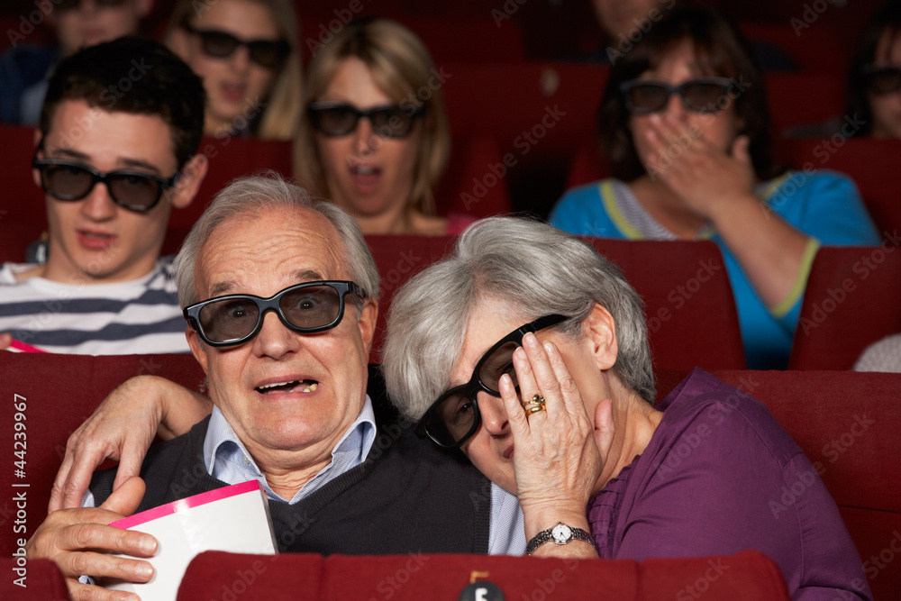 Naklejka premium Senior Couple Watching 3D Film In Cinema
