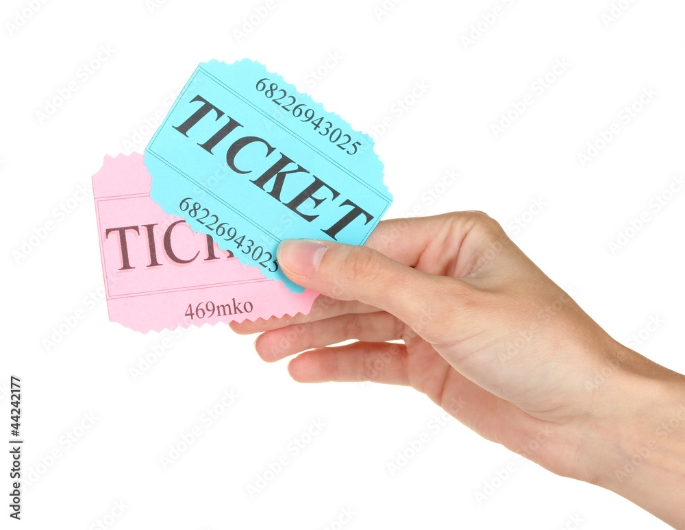 Woman's hand holding a colorful tickets Woman's hand holding a colorful tickets