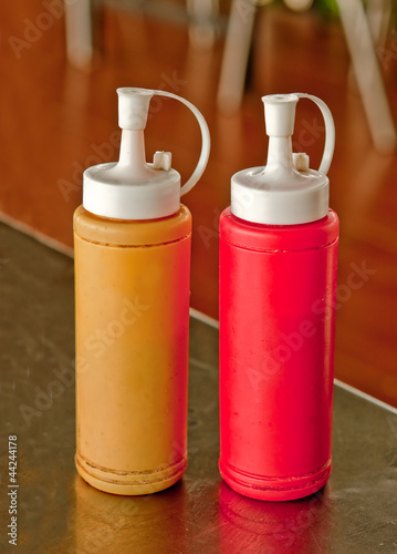 Mustard and ketchup bottle on dining table