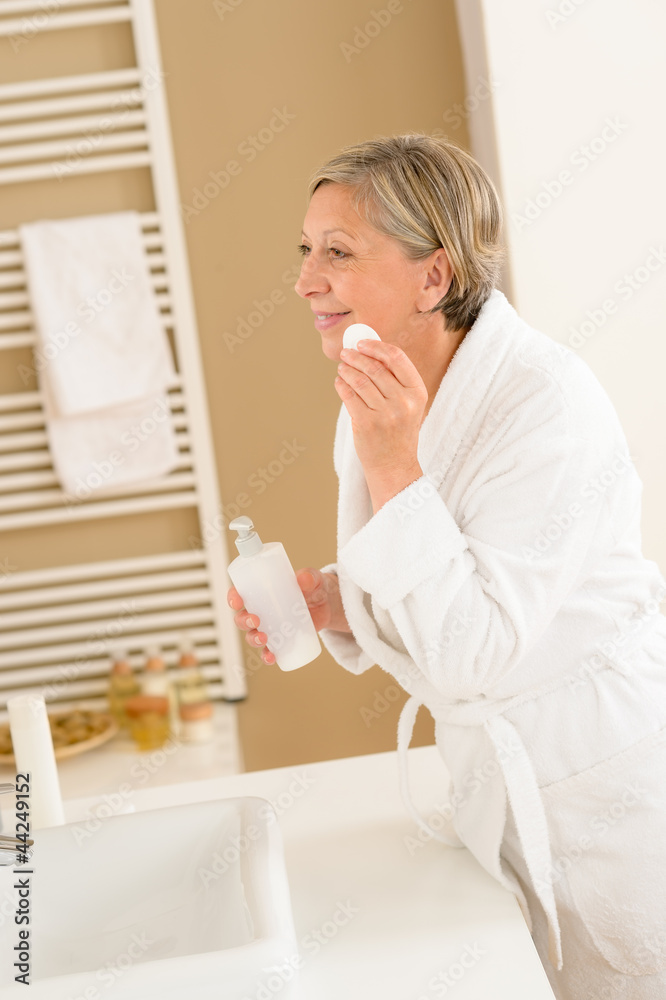 Mature woman bathroom clean face make-up removal Mature woman bathroom clean face make-up removal