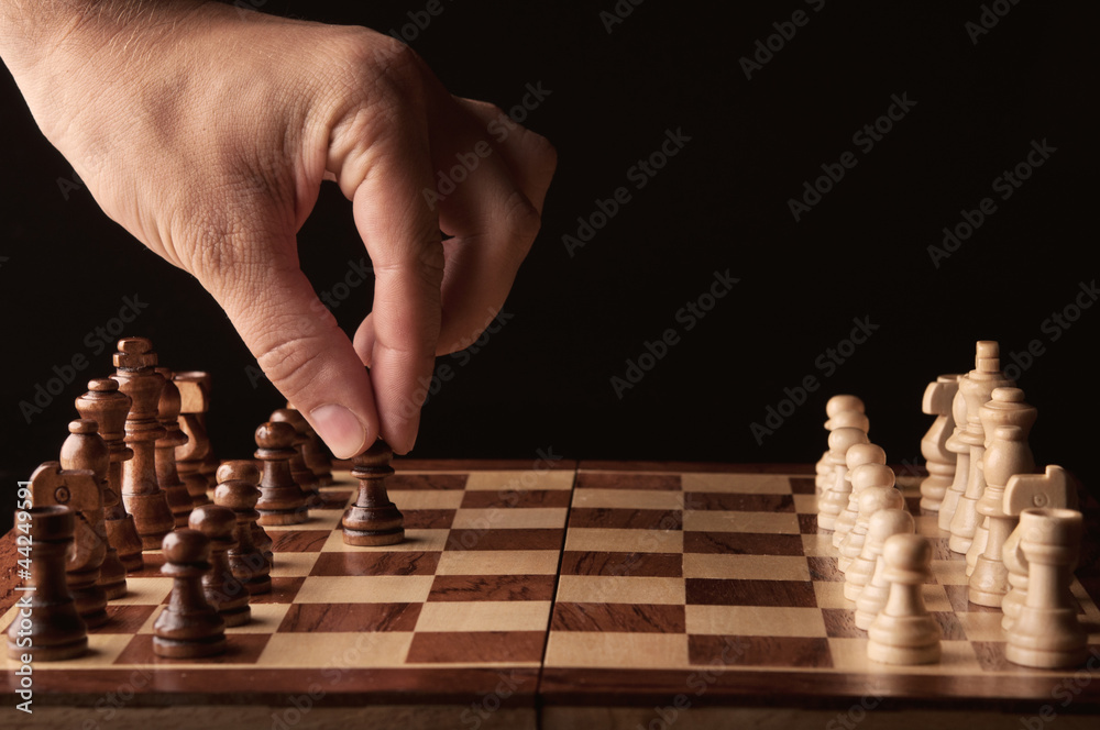 man plays chess