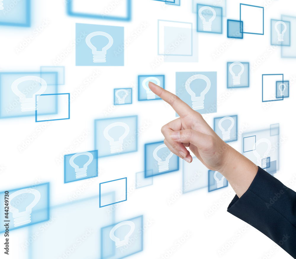 Hand pushing bulb light button on a touch screen interface Hand pushing bulb light button on a touch screen interface