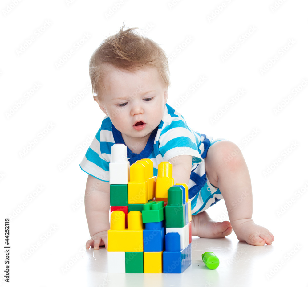 cheerful child boy playing with construction set over white back cheerful child boy playing with construction set over white back
