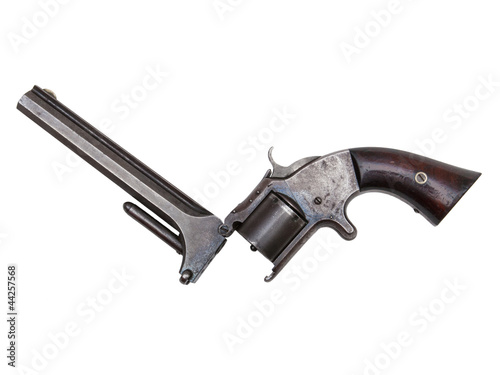 An antique revolver isolated on white