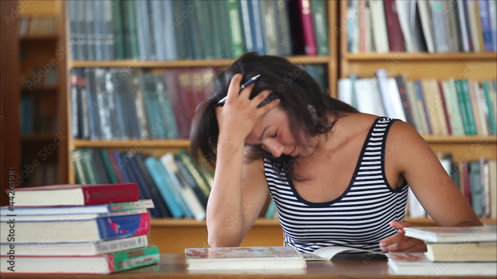 tired beautiful girl student in the library 3 tired beautiful girl student in the library 3