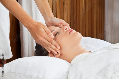 Woman Receiving Head Massage At Spa