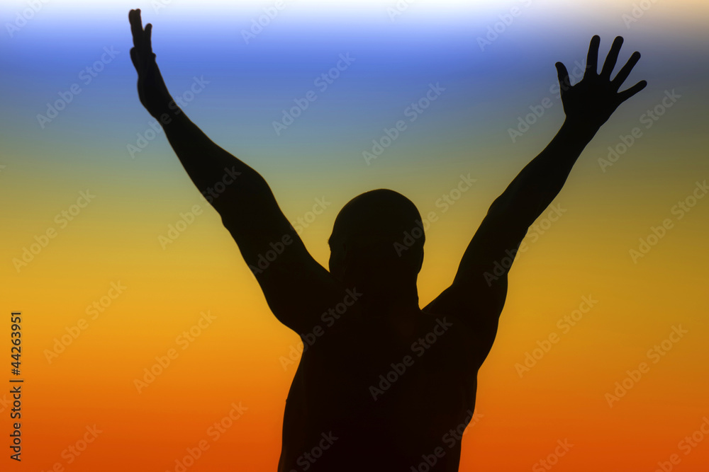 Silhouette of a man on a rainbow background