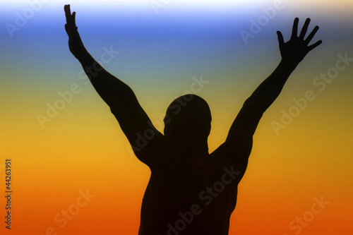 Silhouette of a man on a rainbow background