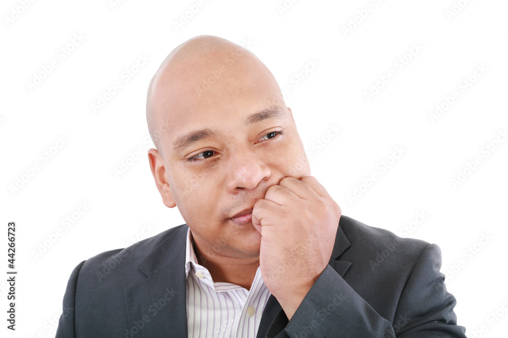 Portrait of a young business man looking away and thinking Portrait of a young business man looking away and thinking