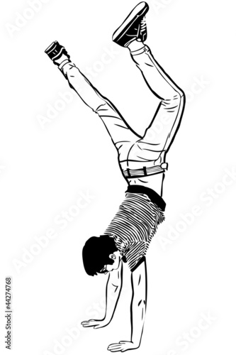 a young man standing on ead over heels