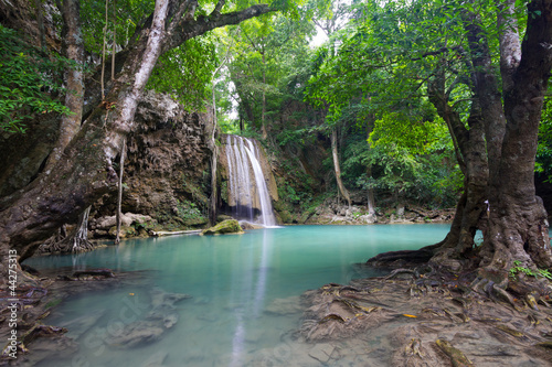 Vibrant Erawan Waterfall with Flowing Water into The Blue Lake