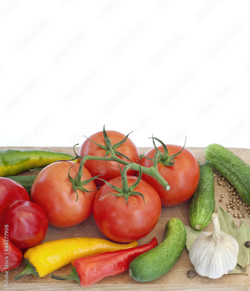 Vegetables and spices on kitchen cutting board