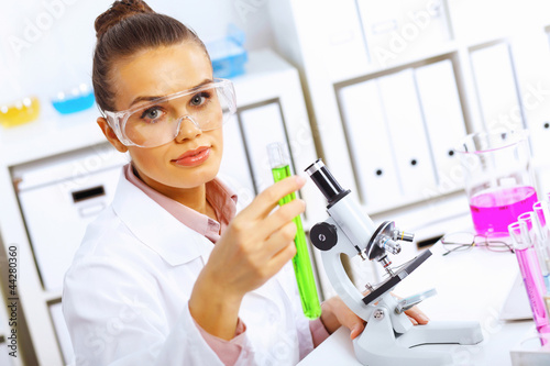 Young female scientist working in laboratory