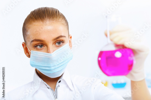 Young female scientist working in laboratory