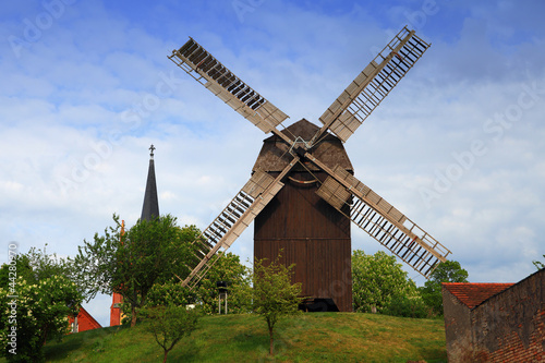 Windmühle mit Kirchturmspitze photo