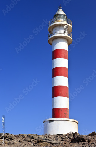 Red and white lighthouse, Faro de Punta Sardina in Gran Canaria