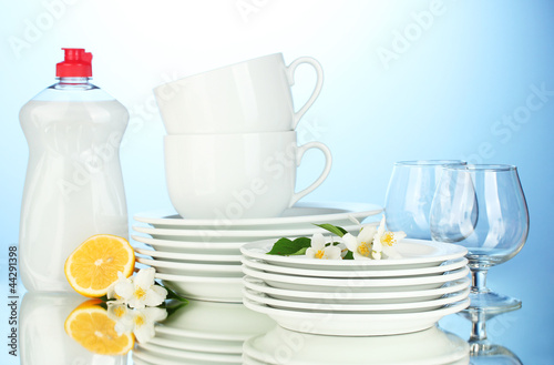 empty clean plates, glasses and cups with dishwashing liquid © Africa Studio