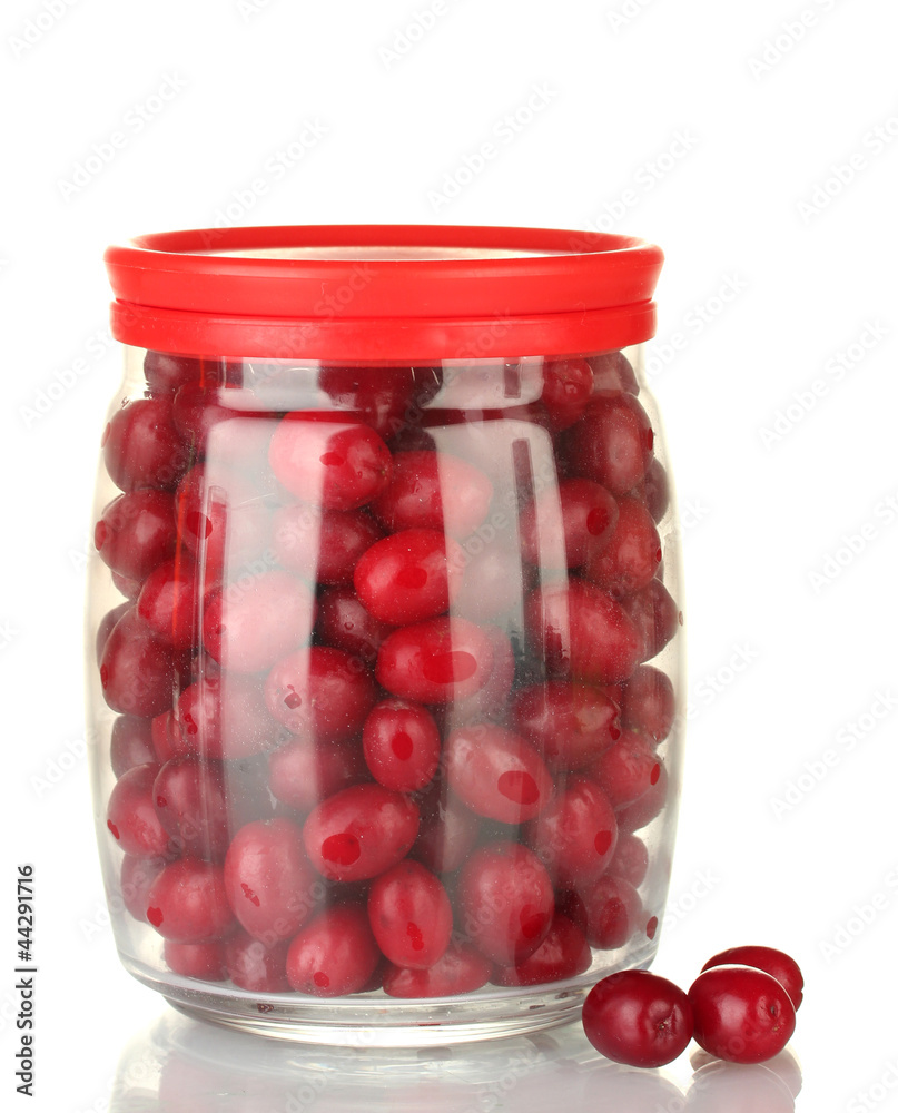 fresh cornel berries in glass jar isolated on white fresh cornel berries in glass jar isolated on white