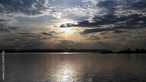 Sunset over the town from shore