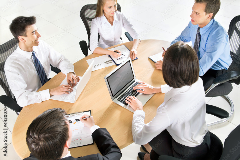 Businesspeople working at meeting Businesspeople working at meeting