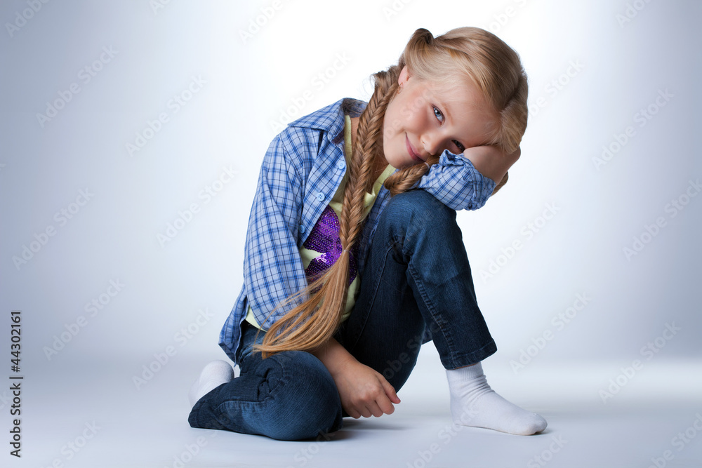 Happy girl sitting on floor Happy girl sitting on floor
