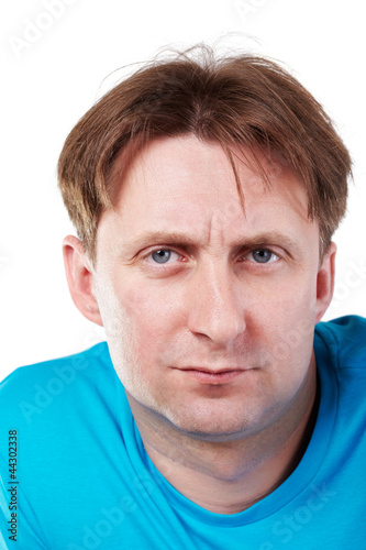 Close-up portrait of man in blue t-shirt.