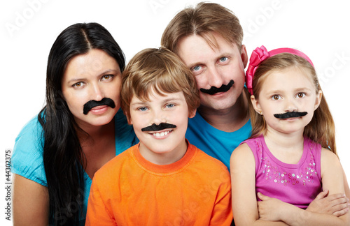 Family of four with glued articial mustaches.