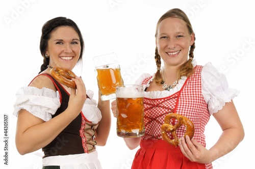 two pretty women in dirndls and pretzels photo