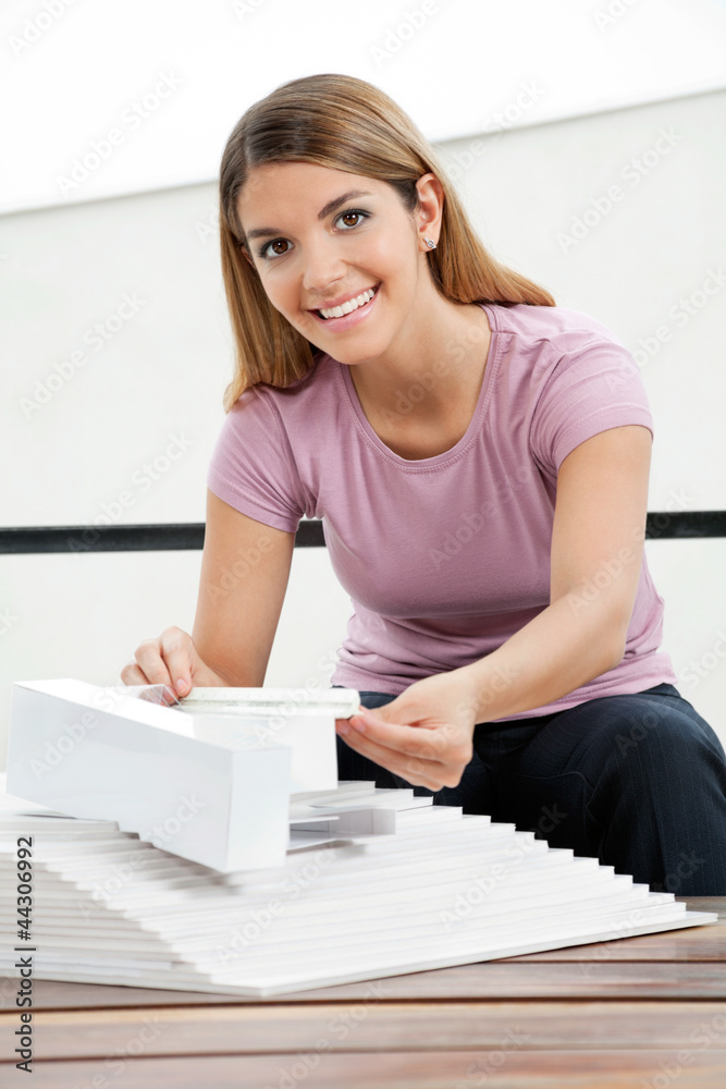 Architect Working On Model