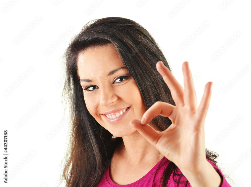 Young attractive woman showing ok sign isolated on white Young attractive woman showing ok sign isolated on white