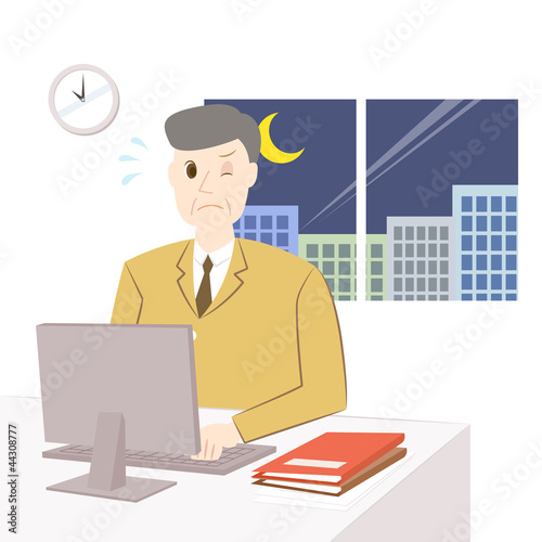 残業をする中年男性