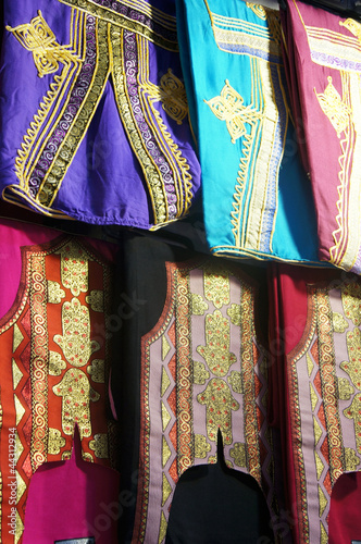 Tunisian colorful clothes hanging in a bazaar